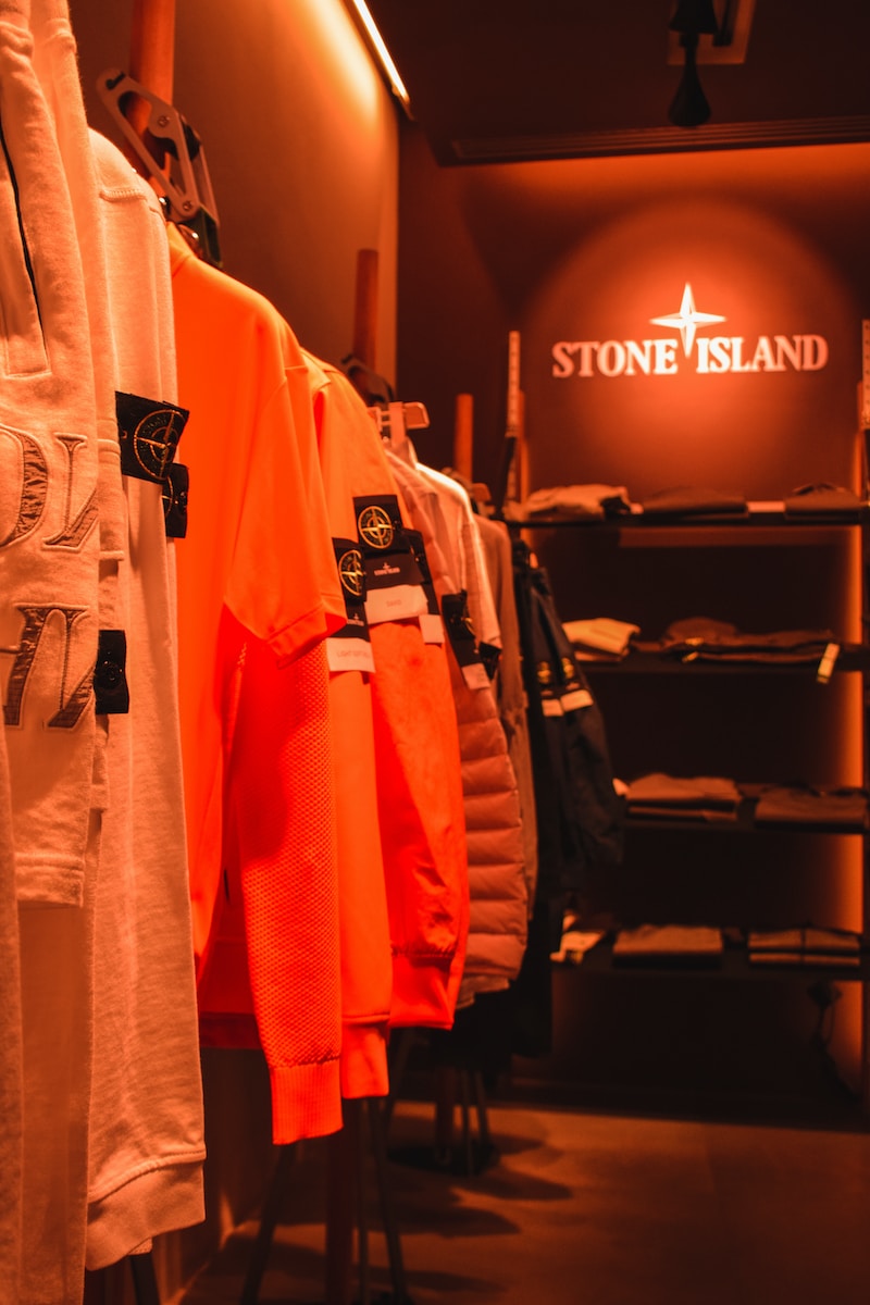 a store filled with lots of orange shirts